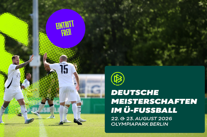 On an outdoor soccer field, several people are standing in white jerseys and soccer cleats. Two people in the center of the image are touching each other with their hands raised. Trees and blurred elements of a sports complex can be seen in the background. Graphic design elements in neon green and purple are superimposed over the photo. Inside a purple circle is the text “Free admission!” To the right is a dark green information box featuring the DFB logo and the caption: “German Senior Soccer Championships, August 22 & 23, 2026, Olympiapark Berlin.”